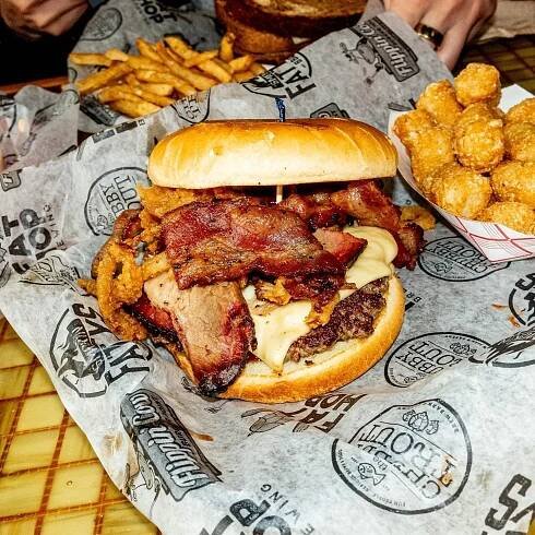 The Stella Moo at Flippin’ Cow. Our own Squarsh Patty topped with smoked brisket, applewood bacon, onion straws, pepper jack cheese and a sweet BBQ sauce on a toasted brioche bun. Voted Best Burger in Elkhart County. 

We don’t get to sto