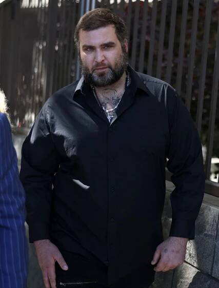 A towering and intimidating Weston Cage leaves a downtown Los Angeles courthouse on July 31 after pleading not guilty to assaulting his mom