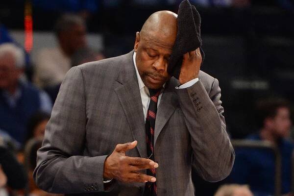Georgetown coach Patrick Ewing mops his brow on the sideline.
