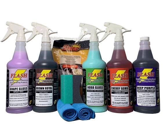 A set of six colorful car cleaning spray bottles with microfiber cloths.