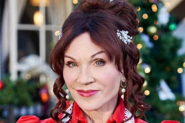 Marilu Henner smiles for the camera on set of "A Kismet Christmas" movie