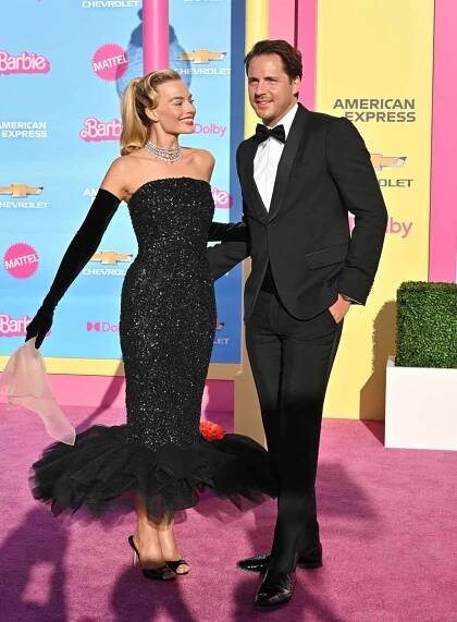 Australian actress Margot Robbie and her husband British producer Tom Ackerley arrive for the world premiere of "Barbie"