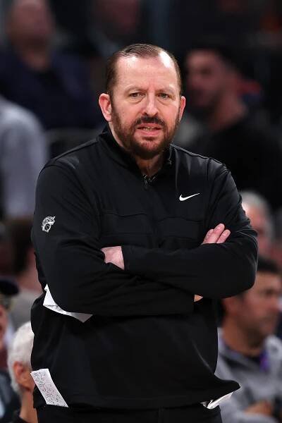 New York Knicks coach with arms crossed.