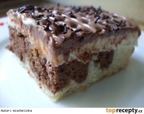 a piece of cake with chocolate frosting and sprinkles sitting on a plate