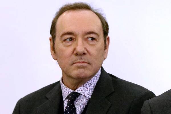 Kevin Spacey stands in district court during arraignment.