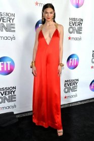 Karlie Kloss wearing a red satin gown