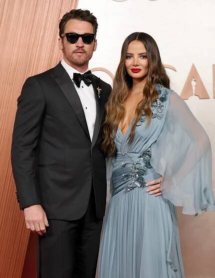 Miles Teller and Keleigh Sperry Teller posing at the 97th Annual Oscars in Hollywood, California