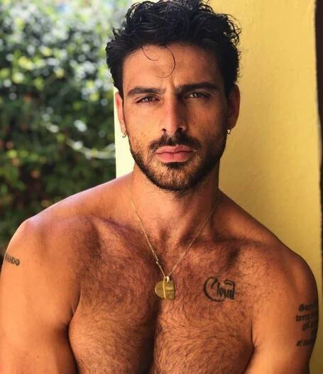 Actor and singer Michele Morrone in an all-black outfit.