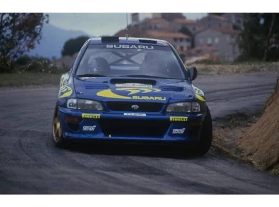 Colin Mcrae on track with his car during Rally race