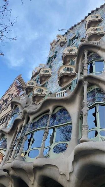 the facade of a building with many windows