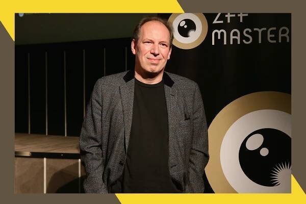 Hans Zimmer grins on the red carpet.