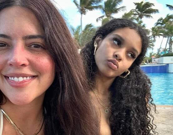 Denise Bidot with her daughter by a pool