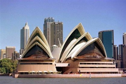 the front of the Sydney Opera House like two groups of 3 triangular white shells, one on top of another like humping shells