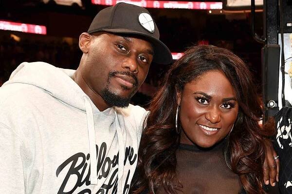Dennis Gelin, Danielle Brooks, Kimberly Blackwell, and Todd Tucker attend the game between the Brooklyn Nets and the Atlanta Hawks at State Farm Arena on November 22, 2023 in Atlanta, Georgia.