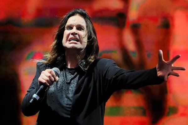 Ozzy Osbourne wearing black during a concert.
