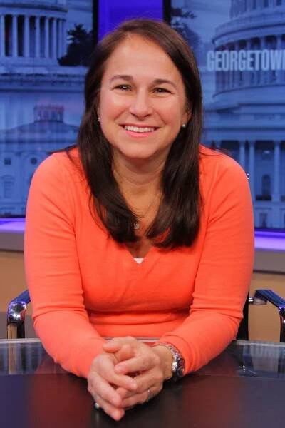 Wendy Zajack in an orange sweater