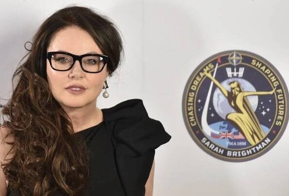 British soprano Sarah Brightman poses for photographs at a news conference in central London