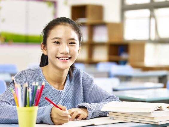Happy Asian Elementary School Girl Stock Image - Image of kong, confidence: 88045847