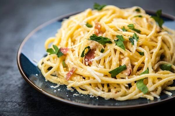 Spaghetti carbonara with parmesan, egg and pancetta
