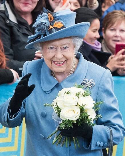 Queen Elizabeth II waving to the crowd.