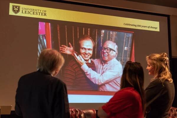 Michael Attenborough shows a photo of him and his father, Richard Attenborough