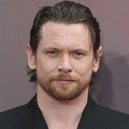 Jack O'Connell with a wet hairstyle on the red carpet