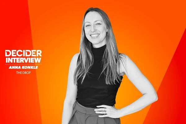 Anna Konkle in black and white on a bright orange background