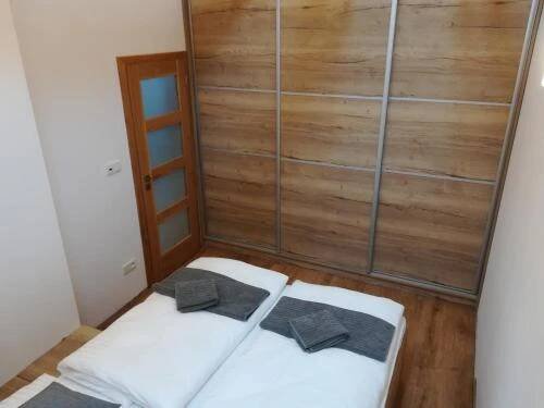 Postel nebo postele na pokoji v ubytování Apartmány U Holubů