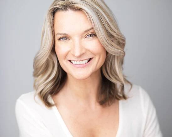 Andrea Powell smiling white shirt