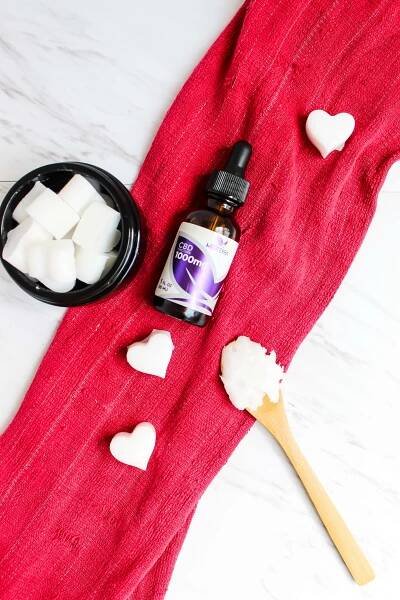 overhead shot of CBD oil pulling chews and a small bottle of CBD oil