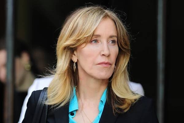 Felicity Huffman walks into court