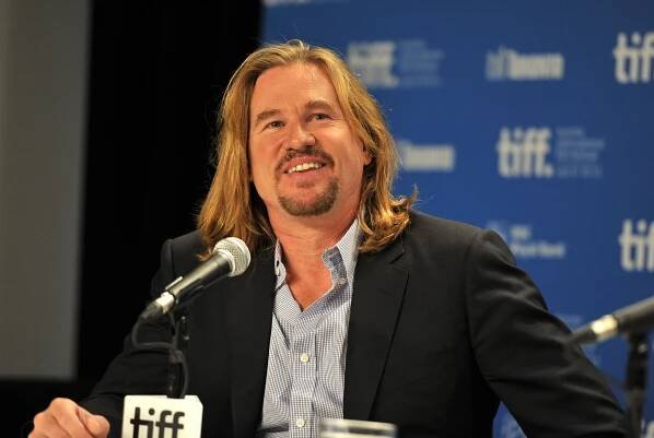 Val Kilmer speaks onstage at the "Twixt" press conference in 2011.