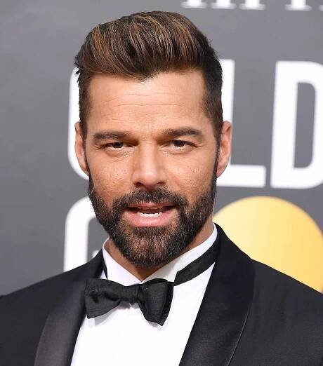 Ricky martin with a caesar haircut styled as a pompadour