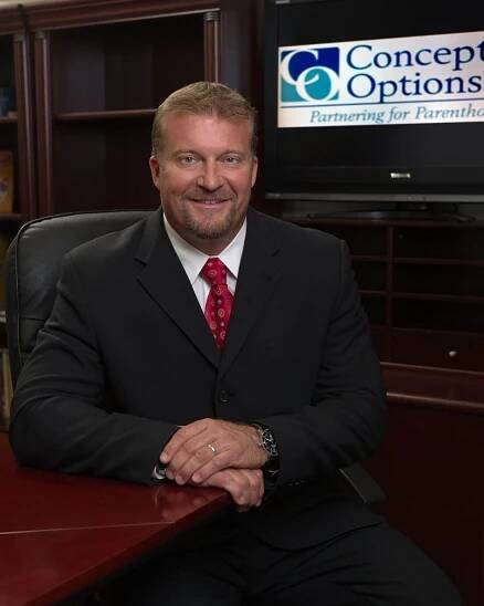 Portrait of CEO John Erickson in the board room. Executive photography by William Morton of Morton Visuals.