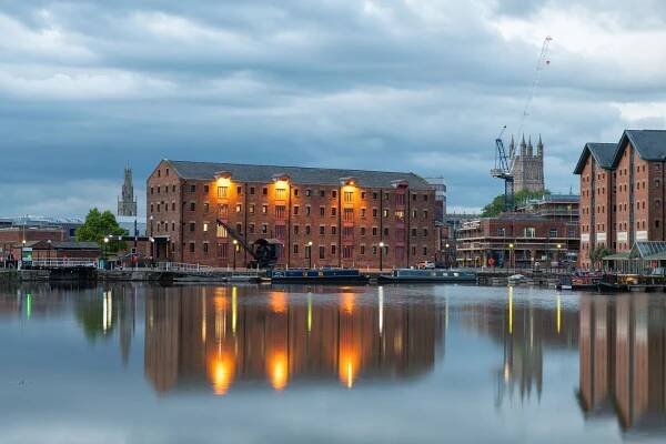 Warehouse in Gloucester Docks lit up in the early evening