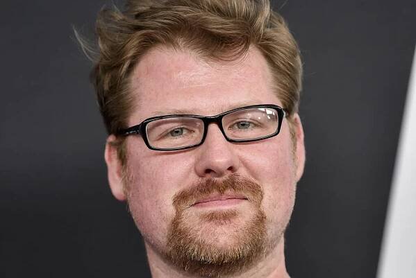 Justin Roiland wearing glasses and a t-shirt