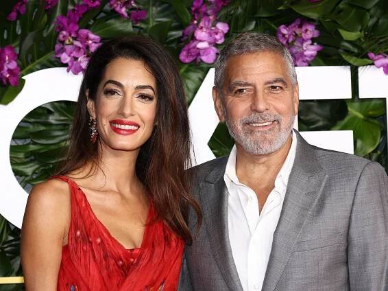 George Clooney Helped Amal Clooney With Her Dress on the Red Carpet