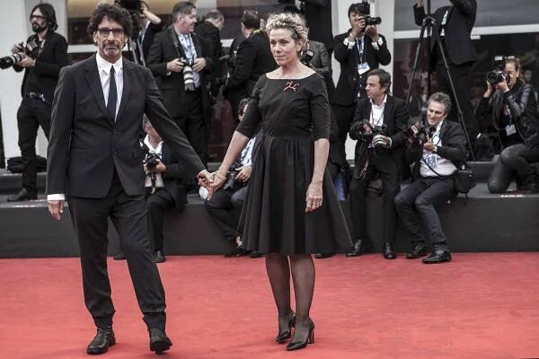 Joel Coen and Frances McDormand attend the premiere of "Olive Kitteridge" at the 71st International Venice Film Festival on September 1, 2014 in Venice, Italy. Francis McDormand was awarded with the Persol Tribute award to Visionary talent 2014. 