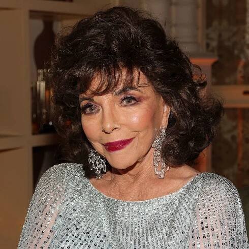 Joan Collins is the ultimate vixen in daring thigh-high split dress