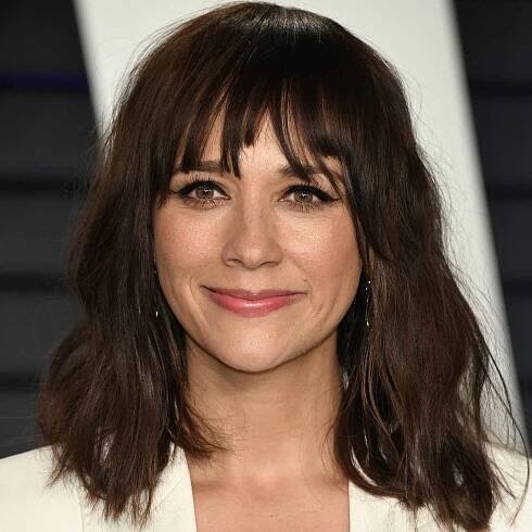 Rashida Jones wavy shoulder-length hair with choppy bangs