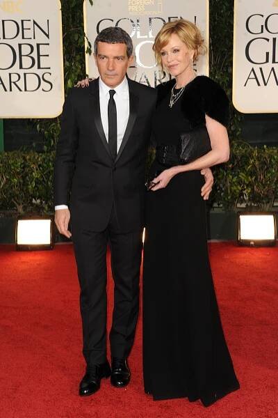 Antonio Banderas (L) and Melanie Griffith attend the 69th annual Golden Globe Awards at the Beverly Hilton. (Photo by Tyler Boye/WWD/Penske Media via Getty Images)