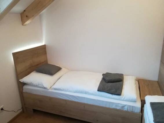 Postel nebo postele na pokoji v ubytování Apartmány U Holubů