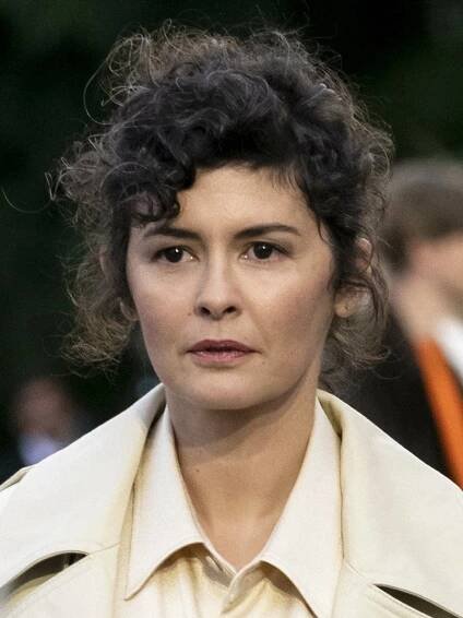 Pensive Audrey Tautou with Curly Hair - Actress in Reflection Wallpaper
