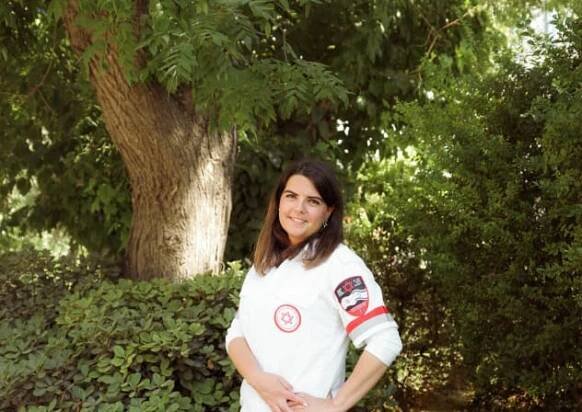 IN HER Magen David Adom uniform. 