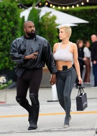 Kanye West and Bianca Censori hold hands while walking in LA.