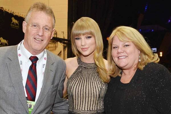 Taylor Swift's Parents Andrea and Scott Share a Sweet Moment in Audience During Emotional Mashup Before Eras Tour End