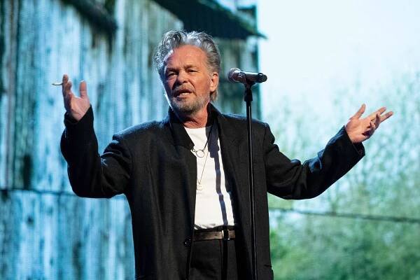 John Mellencamp performing onstage.