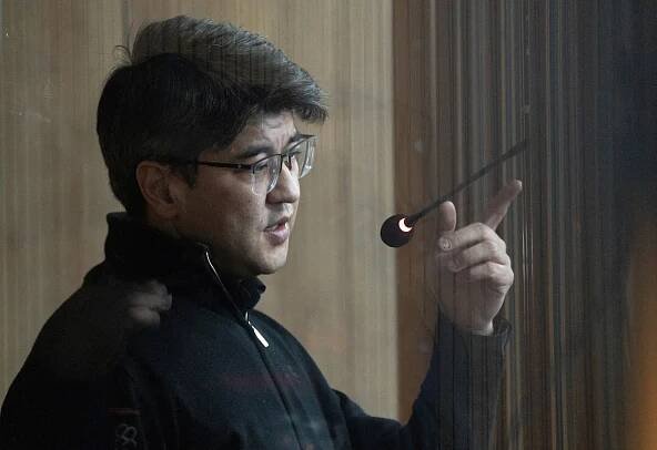 Kazakhstan's former Economy Minister Kuandyk Bishimbayev attends a court hearing in Astana