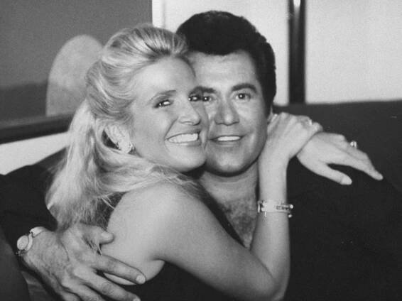 Wayne Newton posing cheek-to-cheek w. his fiancee Kathleen McCrone