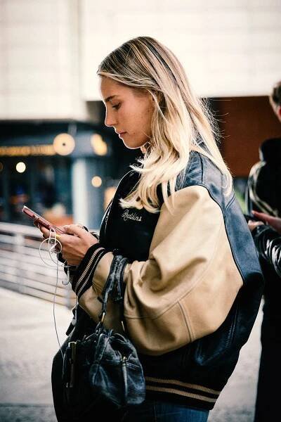 Image may contain Vahina Giocante Accessories Bag Handbag Clothing Coat Jacket Blonde Hair Person Face and Head